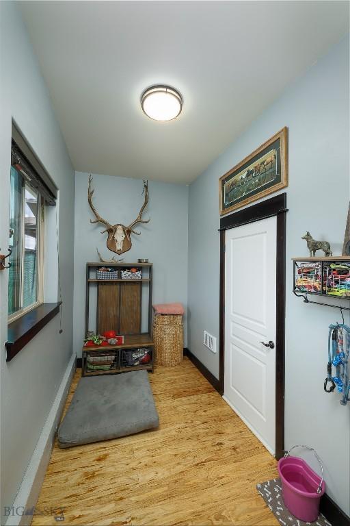 4156 Sunstone St, Bozeman, MT 59718 - corridor featuring baseboards and wood finished floors