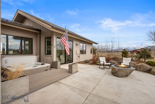 676 Tillyfour, Bozeman, MT 59718 - view of patio / terrace featuring an outdoor fire pit and a hot tub