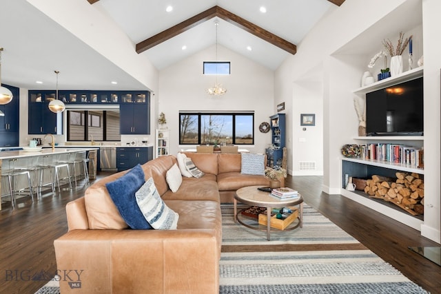 676 Tillyfour, Bozeman, MT 59718 - living room with beam ceiling, dark wood finished floors, high vaulted ceiling, baseboards, and recessed lighting