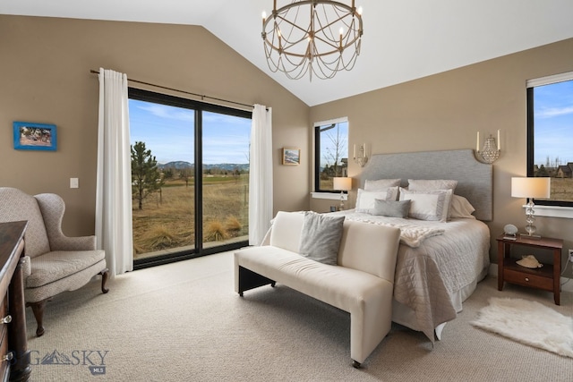 676 Tillyfour, Bozeman, MT 59718 - bedroom featuring a chandelier, carpet flooring, access to outside, and high vaulted ceiling