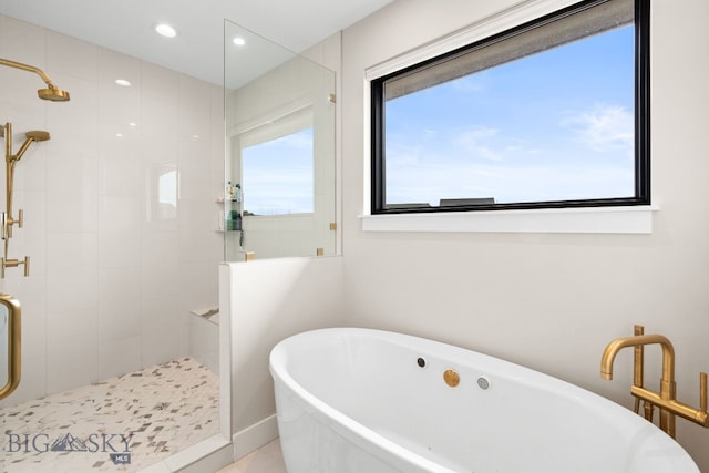 676 Tillyfour, Bozeman, MT 59718 - bathroom with a shower stall, a freestanding tub, and recessed lighting