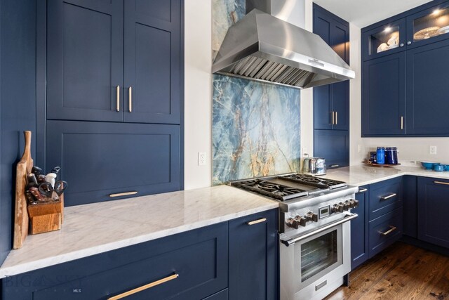 676 Tillyfour, Bozeman, MT 59718 - kitchen with high end stainless steel range oven, exhaust hood, blue cabinetry, glass insert cabinets, and backsplash