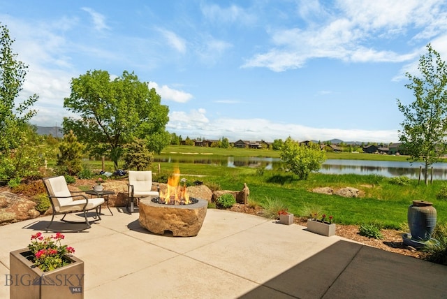676 Tillyfour, Bozeman, MT 59718 - view of patio featuring a fire pit and a water view