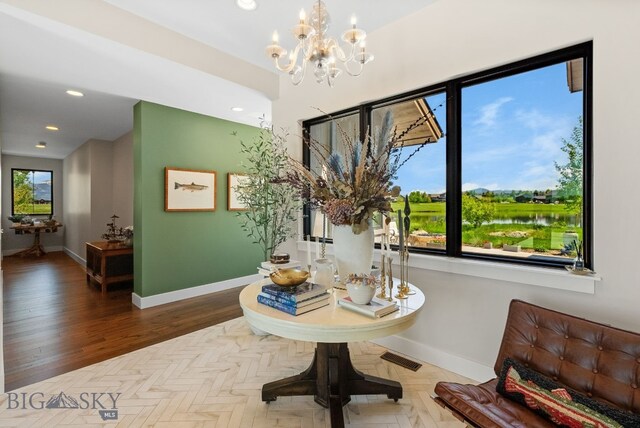 676 Tillyfour, Bozeman, MT 59718 - dining area featuring recessed lighting, a chandelier, and parquet floors
