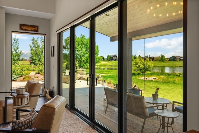 676 Tillyfour, Bozeman, MT 59718 - doorway featuring a water view, healthy amount of natural light, and french doors