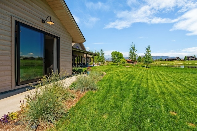 676 Tillyfour, Bozeman, MT 59718 - view of green lawn featuring a mountain view