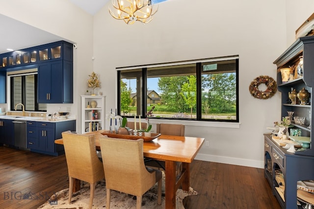 676 Tillyfour, Bozeman, MT 59718 - dining area featuring a high ceiling, dark wood finished floors, and a chandelier
