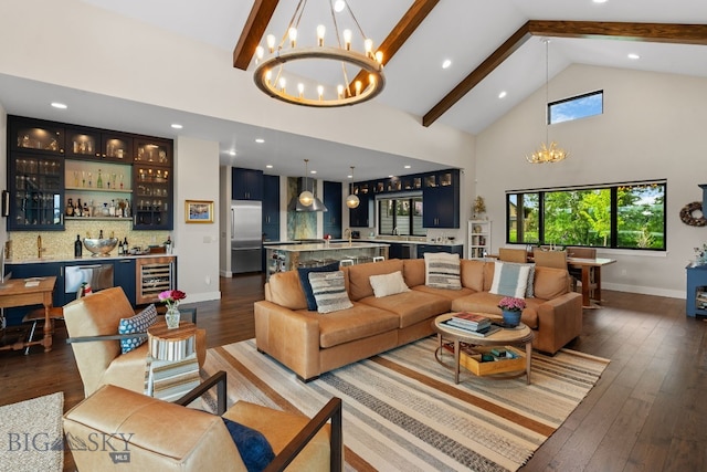 676 Tillyfour, Bozeman, MT 59718 - living area with a chandelier, wine cooler, bar with sink, beam ceiling, and high vaulted ceiling