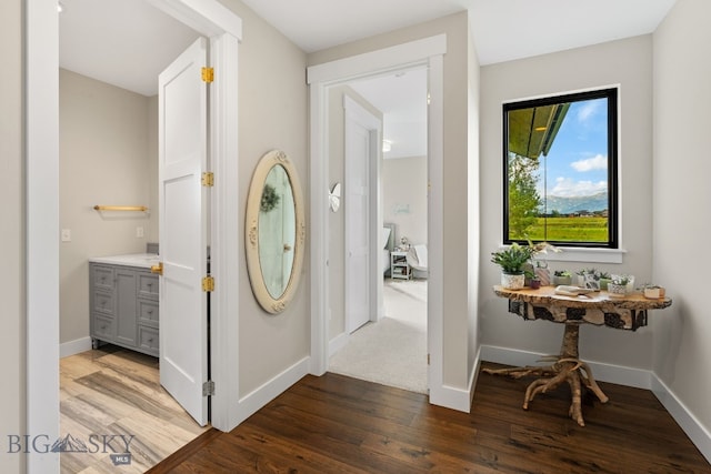 676 Tillyfour, Bozeman, MT 59718 - corridor with wood finished floors and baseboards