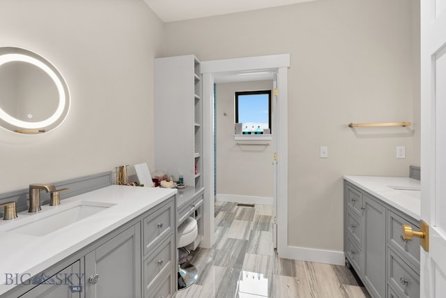676 Tillyfour, Bozeman, MT 59718 - full bathroom featuring vanity and baseboards