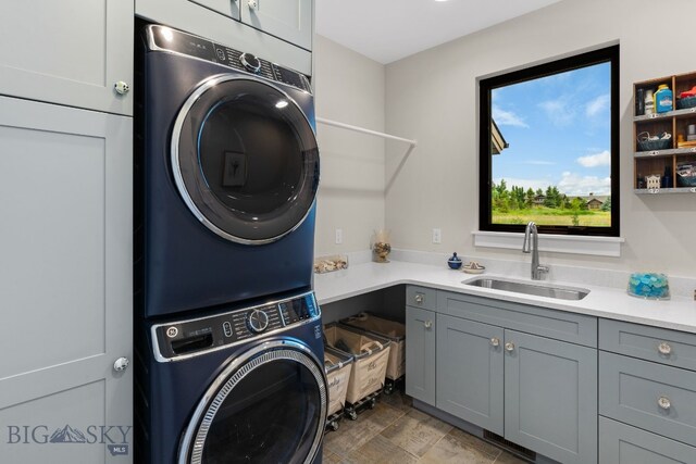 676 Tillyfour, Bozeman, MT 59718 - washroom with stacked washer / drying machine and cabinet space
