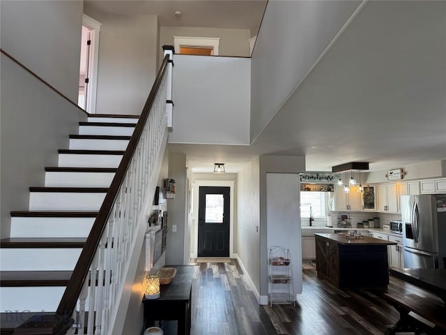 23 Indian Rings Rd, Big Timber, MT 59011 - entrance foyer with dark wood-style flooring and stairway