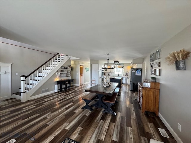 23 Indian Rings Rd, Big Timber, MT 59011 - dining room featuring stairway and dark wood-type flooring