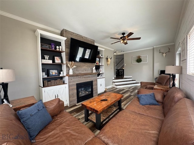 23 Indian Rings Rd, Big Timber, MT 59011 - living area featuring a ceiling fan, crown molding, stairway, a fireplace, and wood finished floors