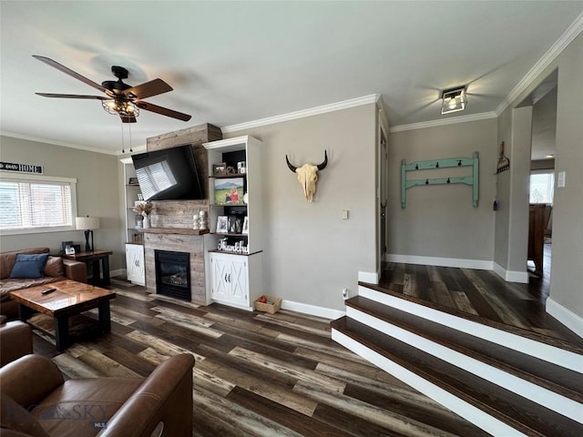 23 Indian Rings Rd, Big Timber, MT 59011 - living room with ceiling fan, dark wood-style floors, a large fireplace, ornamental molding, and stairs