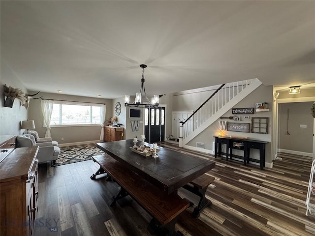 23 Indian Rings Rd, Big Timber, MT 59011 - dining space with stairway, dark wood finished floors, and a chandelier