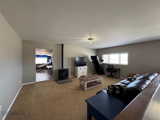 23 Indian Rings Rd, Big Timber, MT 59011 - carpeted living area with healthy amount of natural light and a wood stove