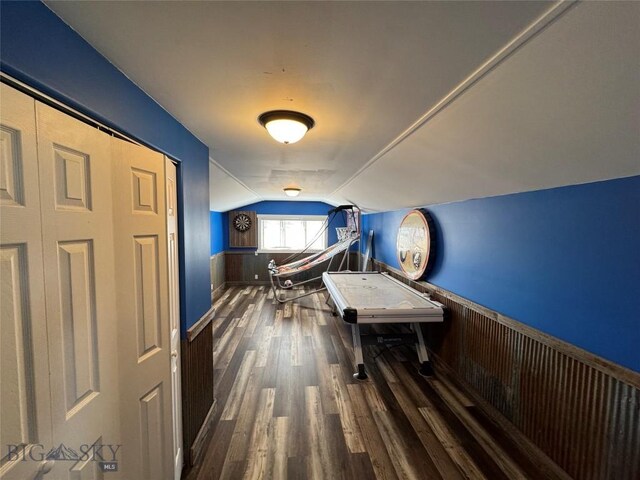 23 Indian Rings Rd, Big Timber, MT 59011 - bedroom with dark wood-style flooring, lofted ceiling, and wainscoting