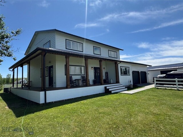 23 Indian Rings Rd, Big Timber, MT 59011 - rear view of house with a garage, a porch, and a lawn