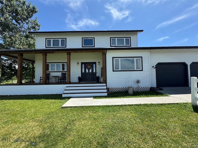 23 Indian Rings Rd, Big Timber, MT 59011 - view of front facade featuring a garage, a front lawn, driveway, and a porch