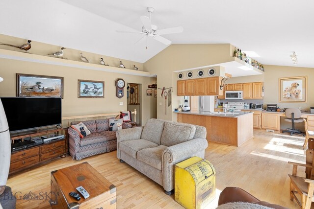 3310 Tumbleweed Dr, Bozeman, MT 59715 - living room with ceiling fan, light wood-style flooring, and lofted ceiling