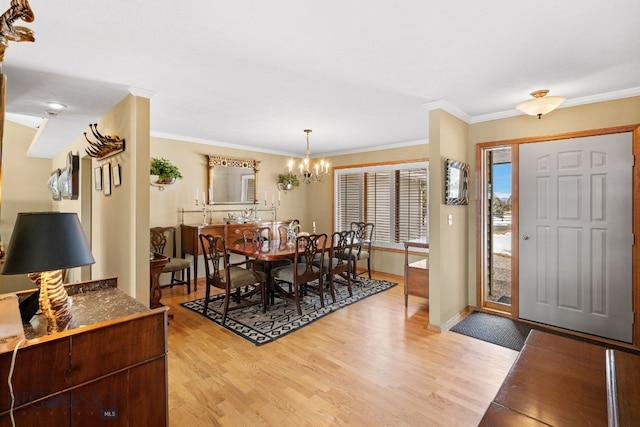 3310 Tumbleweed Dr, Bozeman, MT 59715 - dining space with crown molding, light wood-style flooring, baseboards, and a chandelier