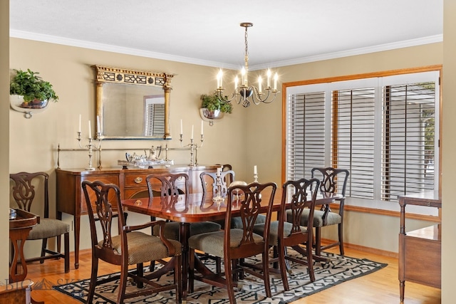3310 Tumbleweed Dr, Bozeman, MT 59715 - dining room with an inviting chandelier, baseboards, ornamental molding, and light wood finished floors