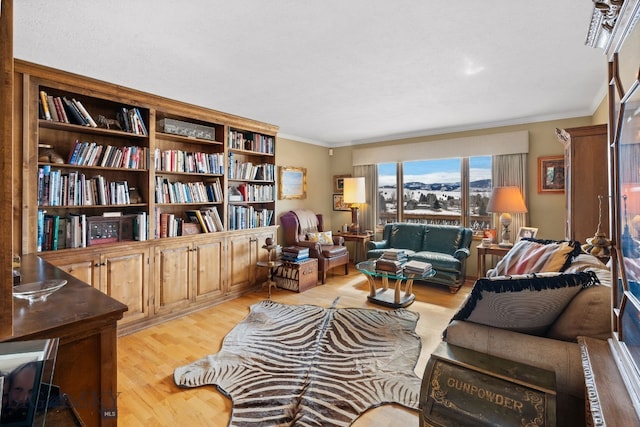 3310 Tumbleweed Dr, Bozeman, MT 59715 - sitting room with ornamental molding and light wood finished floors