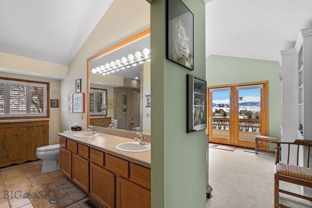 3310 Tumbleweed Dr, Bozeman, MT 59715 - full bathroom featuring a sink, lofted ceiling, toilet, and a shower stall