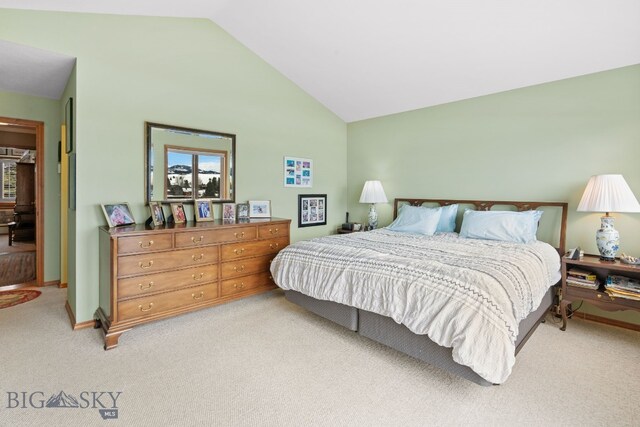 3310 Tumbleweed Dr, Bozeman, MT 59715 - bedroom featuring vaulted ceiling and light carpet
