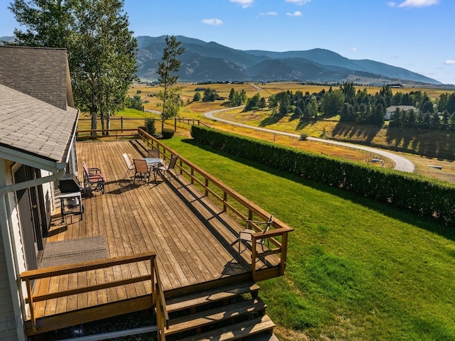 3310 Tumbleweed Dr, Bozeman, MT 59715 - wooden terrace with a lawn, a rural view, and a mountain view