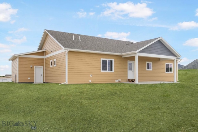 6 S Durango Trl, Three Forks, MT 59752 - rear view of house with a lawn and roof with shingles
