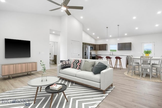6 S Durango Trl, Three Forks, MT 59752 - living room with light wood finished floors, a ceiling fan, high vaulted ceiling, and recessed lighting