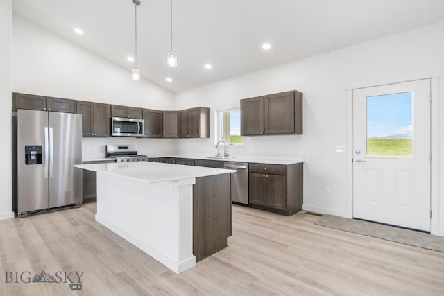 6 S Durango Trl, Three Forks, MT 59752 - kitchen with stainless steel appliances, dark brown cabinetry, light wood finished floors, a kitchen island, and recessed lighting