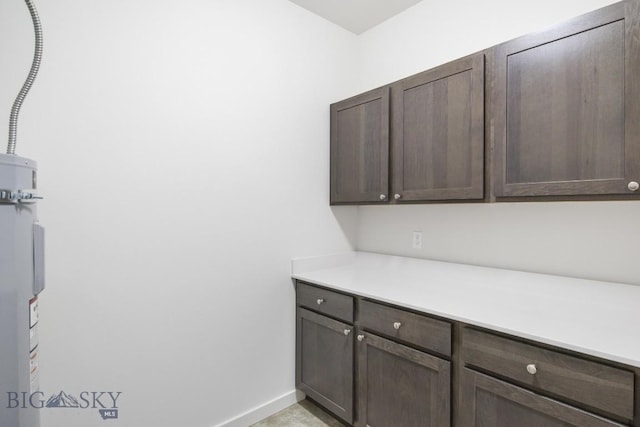 6 S Durango Trl, Three Forks, MT 59752 - kitchen with dark brown cabinetry and light countertops
