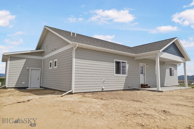 5 S Durango Trl, Three Forks, MT 59752 - rear view of house featuring roof with shingles