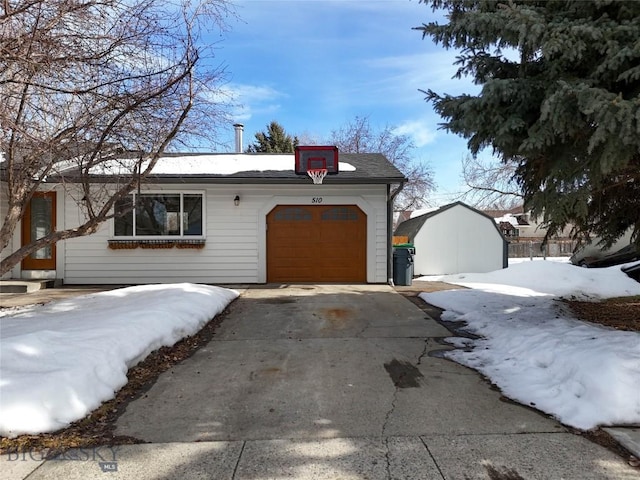 510 Flathead Ave, Bozeman, MT 59715 - view of front facade with a garage and concrete driveway