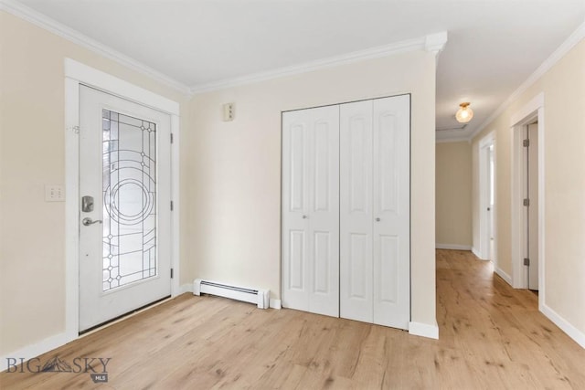 510 Flathead Ave, Bozeman, MT 59715 - foyer entrance with a baseboard heating unit, ornamental molding, light wood finished floors, plenty of natural light, and baseboards