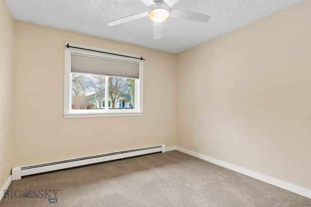 510 Flathead Ave, Bozeman, MT 59715 - unfurnished room featuring a baseboard heating unit, carpet flooring, baseboards, ceiling fan, and a textured ceiling
