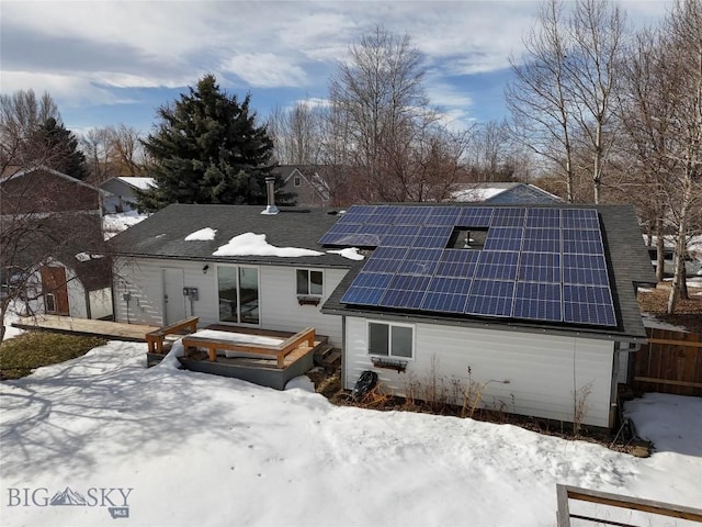 510 Flathead Ave, Bozeman, MT 59715 - snow covered back of property featuring roof mounted solar panels and a shingled roof