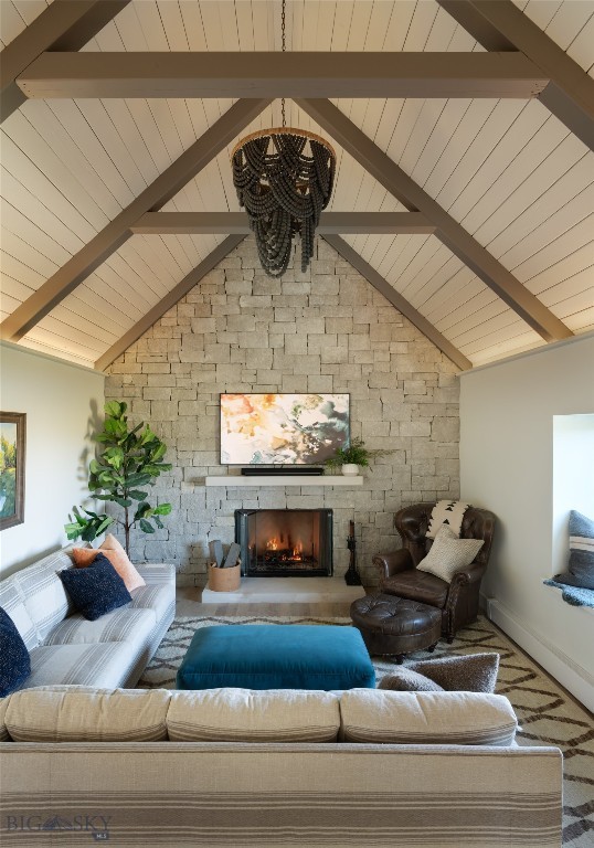 7980 Balsam, Bozeman, MT 59718 - living area with a chandelier, a fireplace, and wood ceiling