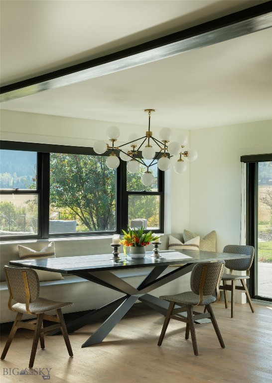 7980 Balsam, Bozeman, MT 59718 - dining space featuring breakfast area, healthy amount of natural light, light wood-style flooring, and a chandelier