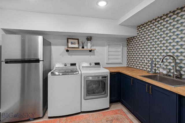 7980 Balsam, Bozeman, MT 59718 - laundry room featuring washer and dryer and recessed lighting