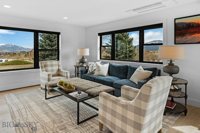7980 Balsam, Bozeman, MT 59718 - living area with healthy amount of natural light, recessed lighting, wood finished floors, and a mountain view