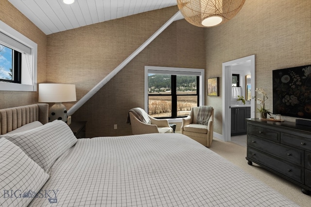 7980 Balsam, Bozeman, MT 59718 - bedroom with high vaulted ceiling, light colored carpet, and ensuite bath