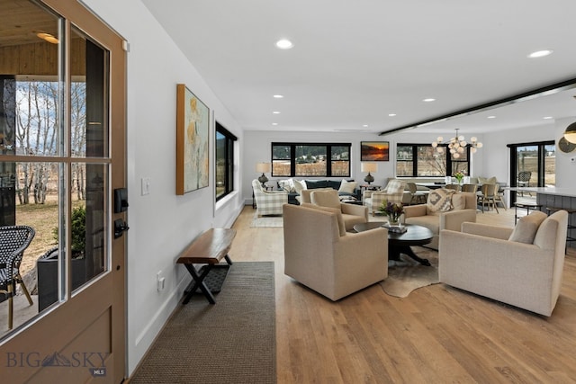7980 Balsam, Bozeman, MT 59718 - living area featuring light wood-style floors, recessed lighting, healthy amount of natural light, and a chandelier