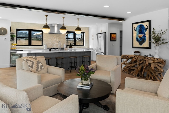 7980 Balsam, Bozeman, MT 59718 - living area featuring wine cooler, light wood finished floors, and recessed lighting
