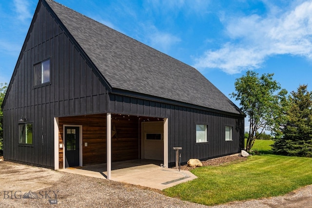 7980 Balsam, Bozeman, MT 59718 - view of property exterior featuring a shingled roof, a garage, a yard, and an outdoor structure