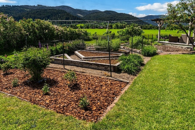 7980 Balsam, Bozeman, MT 59718 - view of yard with a vegetable garden and a mountain view
