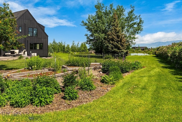7980 Balsam, Bozeman, MT 59718 - view of yard with a vegetable garden and a mountain view